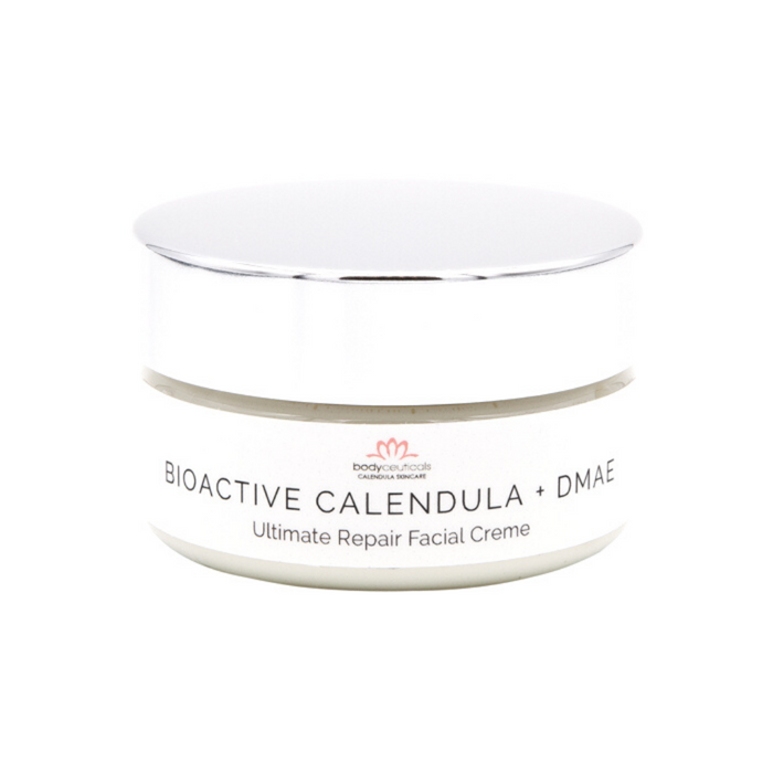 Front of calendula facial cream jar. Metal lid with white label.