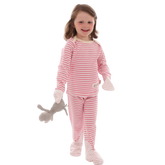 Toddler girl holding stuffed animal and wearing pink and white striped Scratchsleeves pajamas for eczema prone skin.