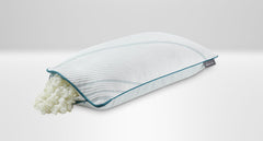 A king-sized Tempur-Pedic memory foam pillow with its cover removed, showing the foam layers, on a white background.
