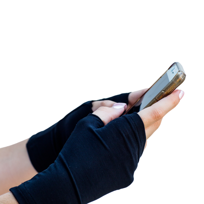 Model wearing black Remedwear gloves to treat palm eczema.