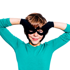 Boy making binocular eyes with his black Remedywear gloves for eczema.
