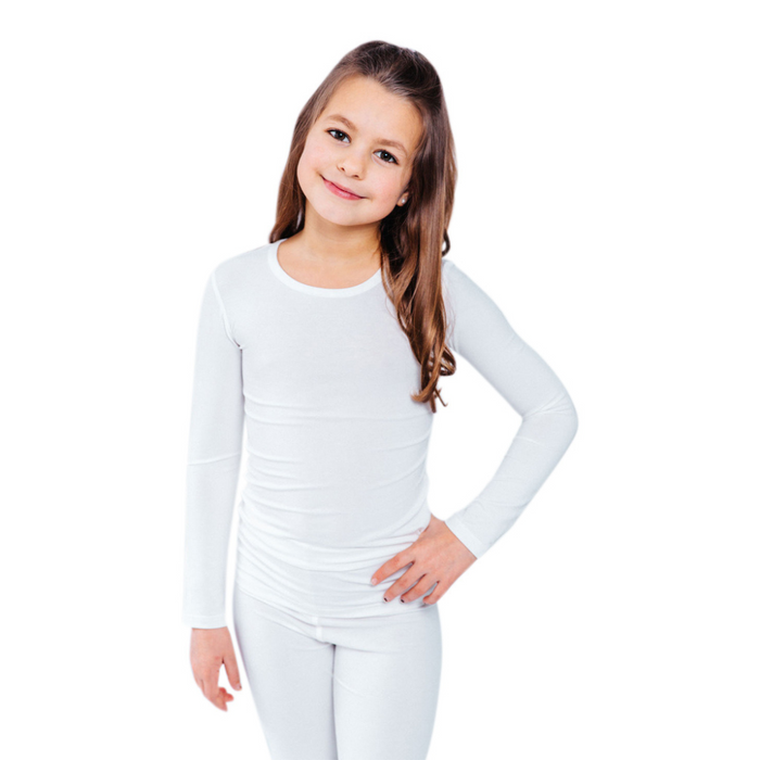 Girl with hand on hip wearing a white Remdywear long sleeve shirt for eczema.