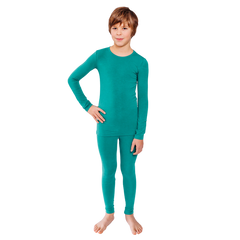 Boy with hand on hip wearing a matching teal Remedywear top and bottom.