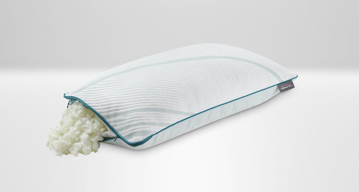 A king-sized Tempur-Pedic memory foam pillow with its cover removed, showing the foam layers, on a white background.